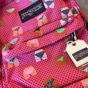 Jansport Pink Backpack with Colorful Shorts Pattern